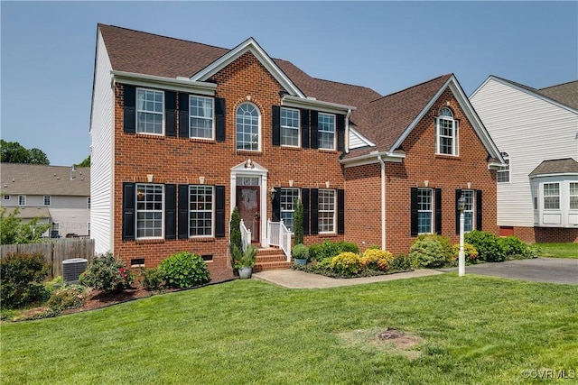 1408 Selma Ln, Henrico, VA 23223 - colonial house featuring brick siding, cooling unit, crawl space, and roof with shingles