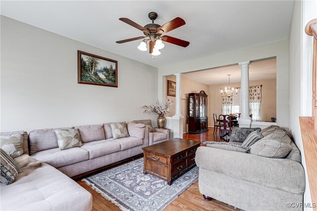 1408 Selma Ln, Henrico, VA 23223 - living area featuring decorative columns, a chandelier, wood finished floors, and ceiling fan