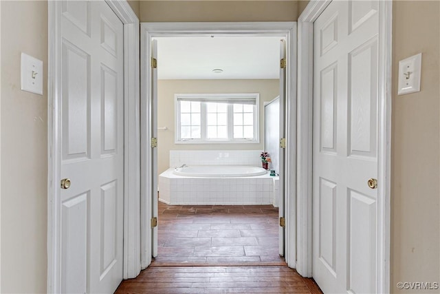 1408 Selma Ln, Henrico, VA 23223 - bathroom featuring hardwood / wood-style flooring and a garden tub