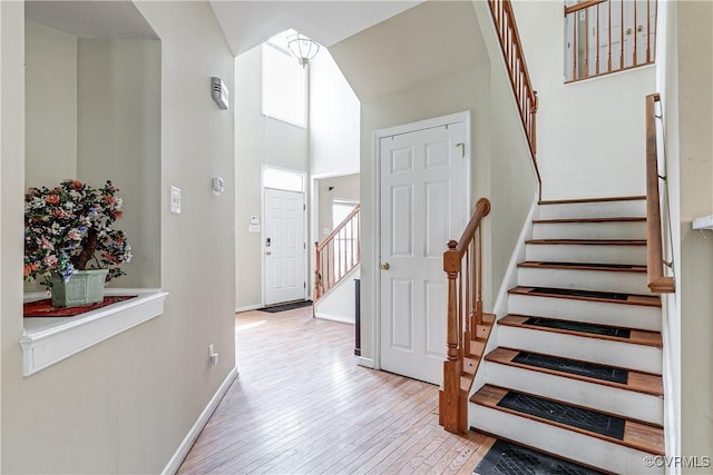 1408 Selma Ln, Henrico, VA 23223 - staircase with hardwood / wood-style floors, baseboards, and a towering ceiling