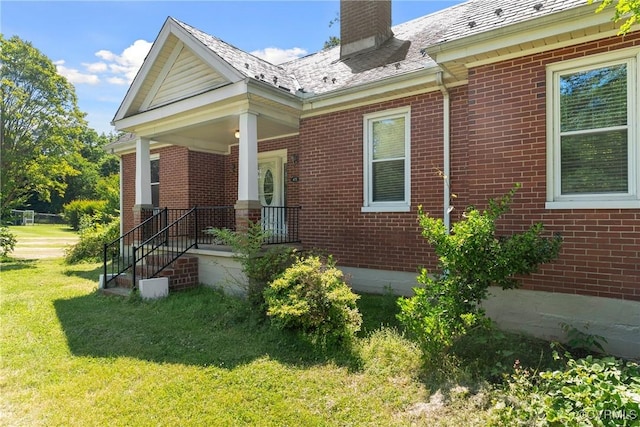 672 Main St, Dillwyn, VA 23936 - view of side of home featuring a lawn and brick siding