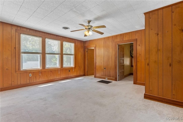 672 Main St, Dillwyn, VA 23936 - unfurnished bedroom featuring carpet, wood walls, baseboards, and a ceiling fan