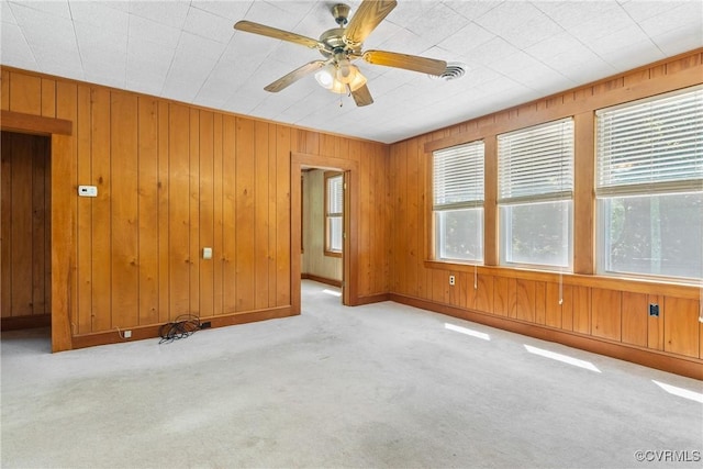 672 Main St, Dillwyn, VA 23936 - spare room featuring carpet, ceiling fan, wooden walls, and baseboards