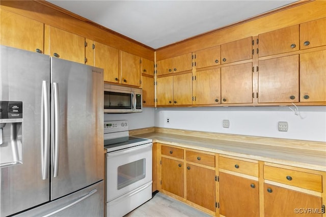 672 Main St, Dillwyn, VA 23936 - kitchen with appliances with stainless steel finishes, light countertops, and brown cabinetry