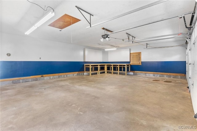 672 Main St, Dillwyn, VA 23936 - garage featuring a garage door opener and baseboards