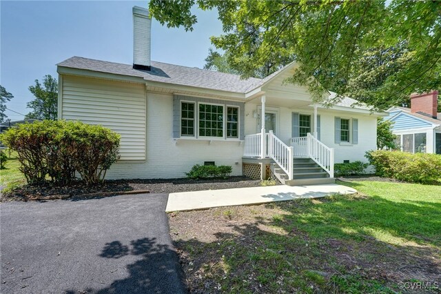 9019 Farmington Dr, Henrico, VA 23229 - ranch-style house with crawl space, brick siding, a front lawn, a chimney, and roof with shingles