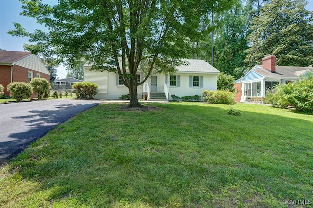 9019 Farmington Dr, Henrico, VA 23229 - view of front of home featuring driveway and a front yard