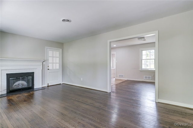 9019 Farmington Dr, Henrico, VA 23229 - unfurnished living room featuring wood finished floors, baseboards, and a brick fireplace