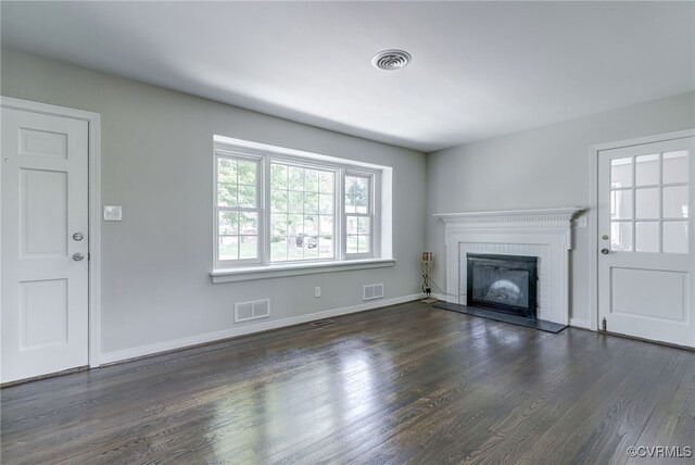 9019 Farmington Dr, Henrico, VA 23229 - unfurnished living room featuring wood finished floors, a brick fireplace, and baseboards