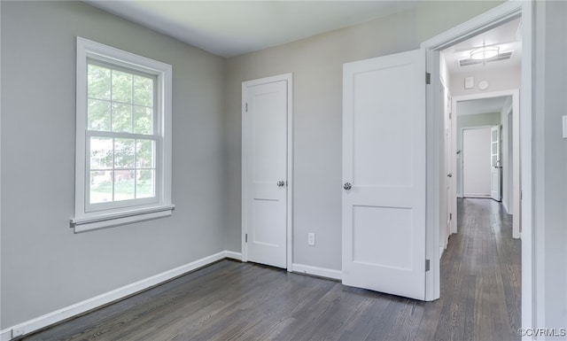 9019 Farmington Dr, Henrico, VA 23229 - unfurnished bedroom with dark wood-type flooring and baseboards