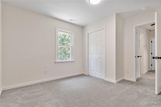 1307 Unison Dr, Chesterfield, VA 23113 - unfurnished bedroom featuring carpet flooring, baseboards, a closet, and attic access