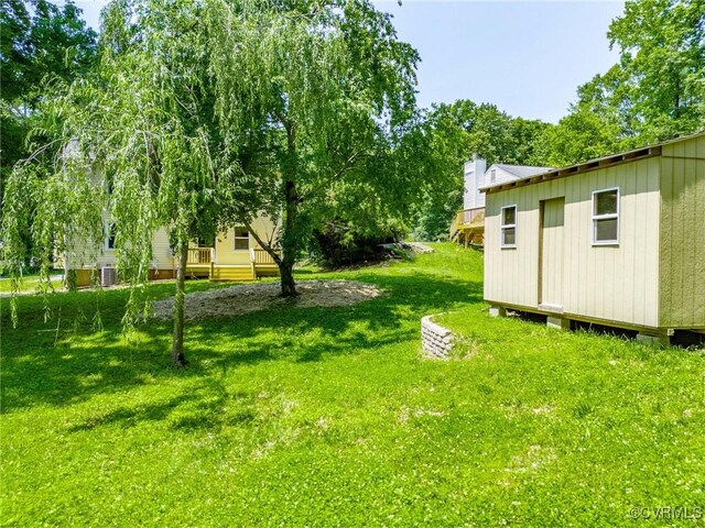 1307 Unison Dr, Chesterfield, VA 23113 - view of green lawn featuring an outbuilding