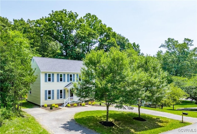 1307 Unison Dr, Chesterfield, VA 23113 - view of front facade featuring curved driveway and a front yard