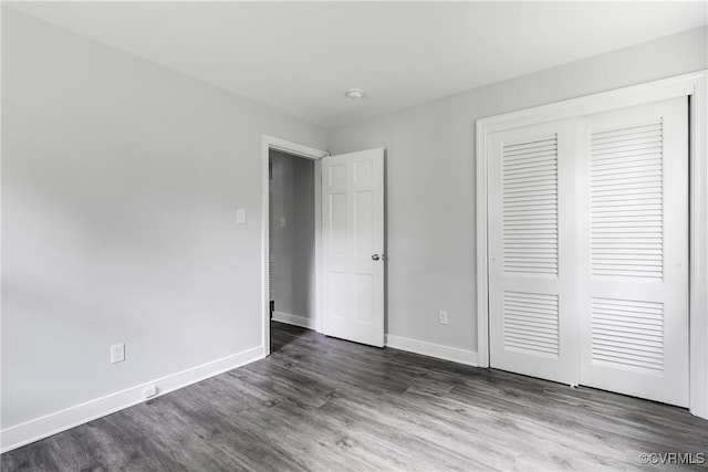 6256 Nicolet Rd, Richmond, VA 23225 - unfurnished bedroom featuring dark wood-style floors, a closet, and baseboards