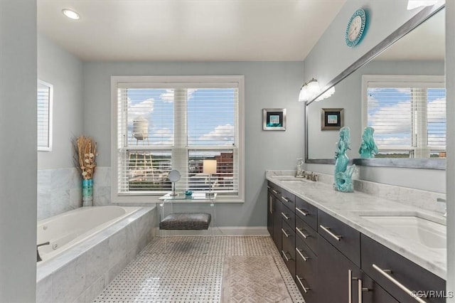 4820 Old Main St Unit 604, Henrico, VA 23231 - bathroom featuring double vanity, a garden tub, plenty of natural light, and baseboards