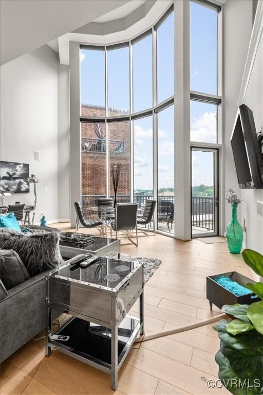 4820 Old Main St Unit 604, Henrico, VA 23231 - living room with a towering ceiling, a wall of windows, and wood finished floors