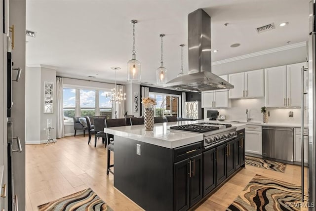 4820 Old Main St Unit 604, Henrico, VA 23231 - kitchen with appliances with stainless steel finishes, island exhaust hood, dark cabinetry, a breakfast bar, and a chandelier