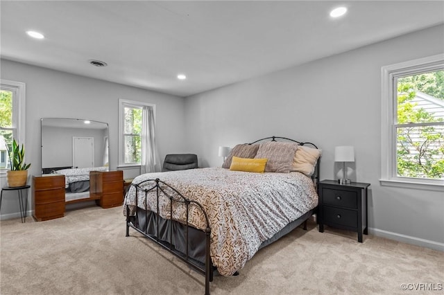 10112 Huntersdell Ln, Chesterfield, VA 23235 - bedroom with light carpet, multiple windows, and recessed lighting