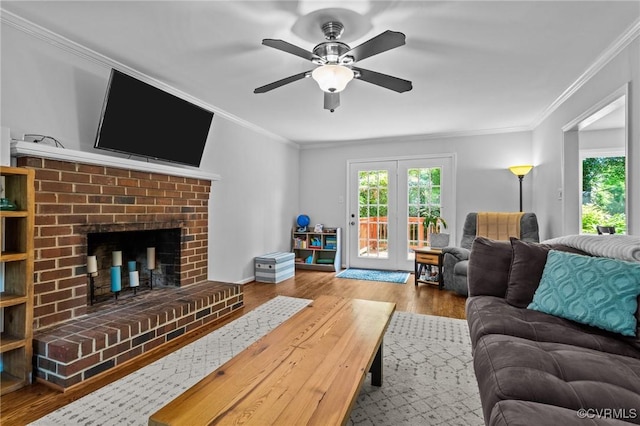 10112 Huntersdell Ln, Chesterfield, VA 23235 - living room with healthy amount of natural light, wood finished floors, ceiling fan, a fireplace, and crown molding