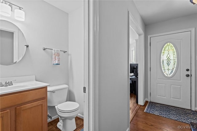 10112 Huntersdell Ln, Chesterfield, VA 23235 - foyer featuring dark wood-style floors and baseboards