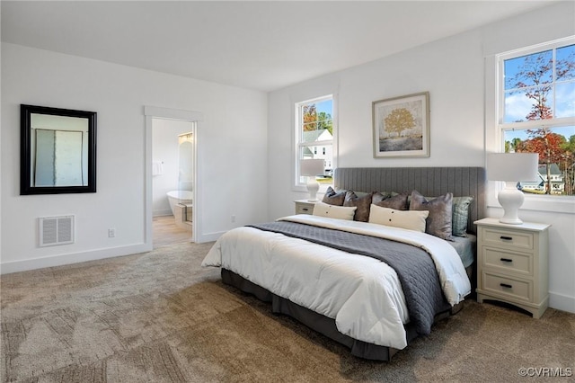11183 Pinewild Dr, Providence Forge, VA 23140 - bedroom featuring light carpet, baseboards, and ensuite bathroom