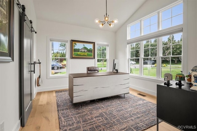 333 Pond View Ln, Goochland, VA 23103 - office space featuring wood finished floors, a chandelier, a barn door, and vaulted ceiling