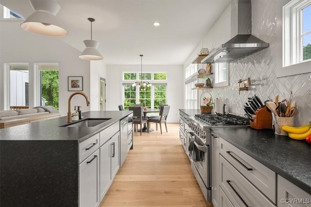 333 Pond View Ln, Goochland, VA 23103 - kitchen featuring appliances with stainless steel finishes, wall chimney exhaust hood, dark countertops, decorative backsplash, and recessed lighting