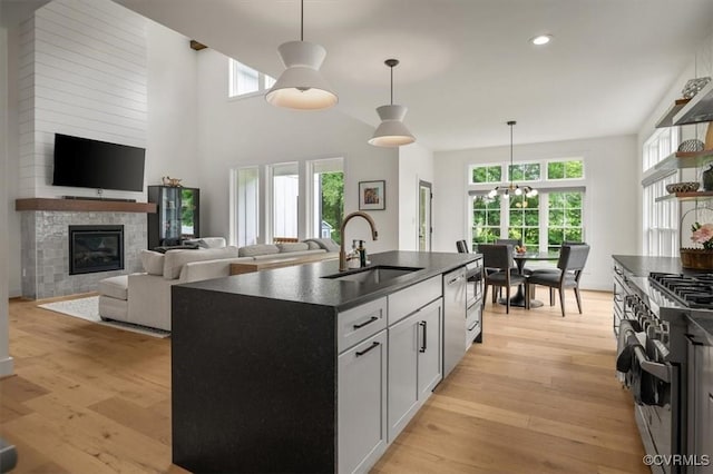 333 Pond View Ln, Goochland, VA 23103 - kitchen featuring dark countertops, appliances with stainless steel finishes, plenty of natural light, light wood-style flooring, and recessed lighting