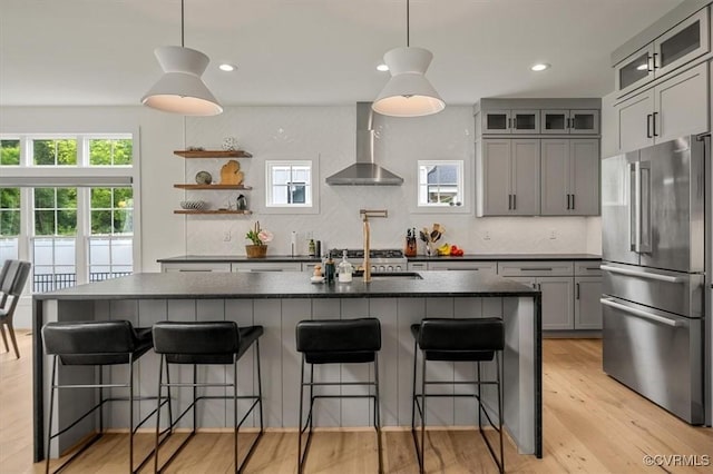333 Pond View Ln, Goochland, VA 23103 - kitchen with wall chimney range hood, high end refrigerator, dark countertops, gray cabinets, and recessed lighting
