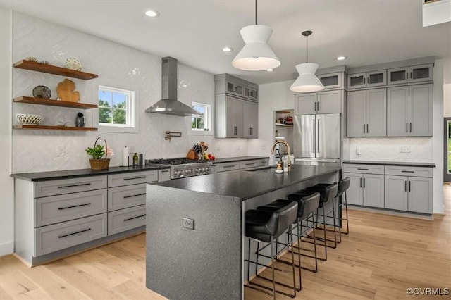 333 Pond View Ln, Goochland, VA 23103 - kitchen featuring wall chimney exhaust hood, stainless steel refrigerator, dark countertops, gray cabinets, and recessed lighting