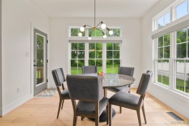 333 Pond View Ln, Goochland, VA 23103 - dining room featuring a chandelier and light wood-style floors