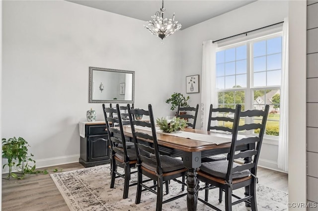 3381 Holywell Cir, Powhatan, VA 23139 - dining area featuring baseboards, a chandelier, plenty of natural light, and light wood-style floors