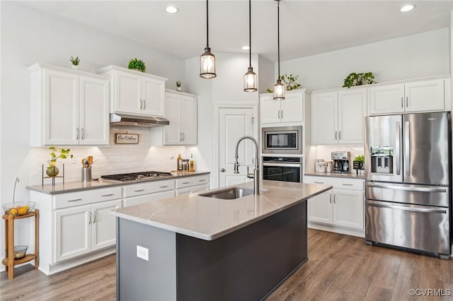 3381 Holywell Cir, Powhatan, VA 23139 - kitchen with stainless steel appliances, a sink, backsplash, under cabinet range hood, and white cabinetry