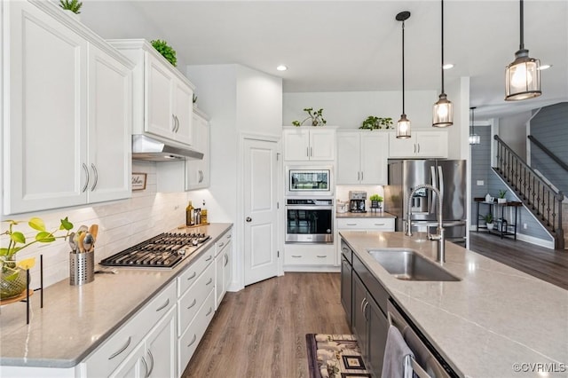 3381 Holywell Cir, Powhatan, VA 23139 - kitchen with appliances with stainless steel finishes, under cabinet range hood, dark wood-style flooring, a sink, and recessed lighting