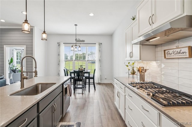 3381 Holywell Cir, Powhatan, VA 23139 - kitchen with a sink, stainless steel appliances, light wood-style flooring, under cabinet range hood, and recessed lighting