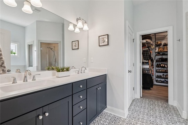 3381 Holywell Cir, Powhatan, VA 23139 - full bathroom featuring a shower stall, double vanity, a spacious closet, and baseboards