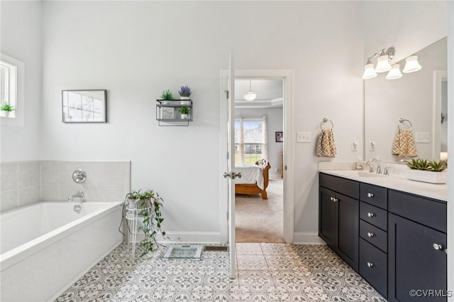 3381 Holywell Cir, Powhatan, VA 23139 - ensuite bathroom featuring double vanity, a bath, baseboards, and tile patterned floors