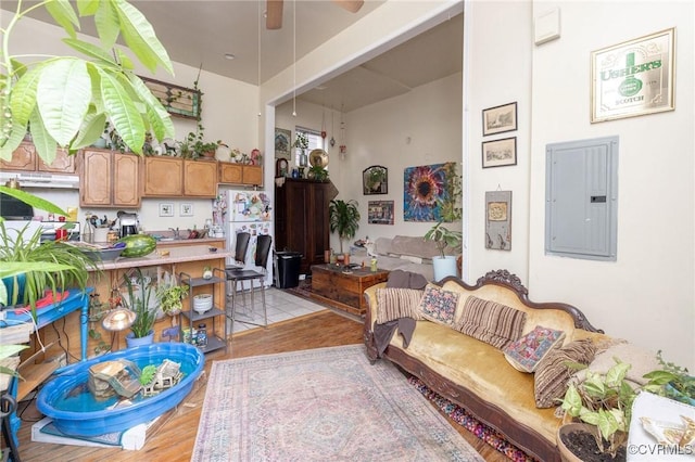 1701 W Leigh St, Richmond, VA 23220 - living area featuring electric panel, light wood-style floors, and a ceiling fan