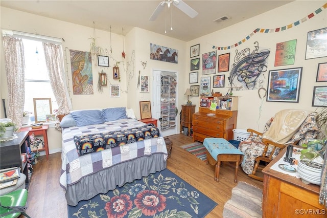 1701 W Leigh St, Richmond, VA 23220 - bedroom with wood finished floors and a ceiling fan