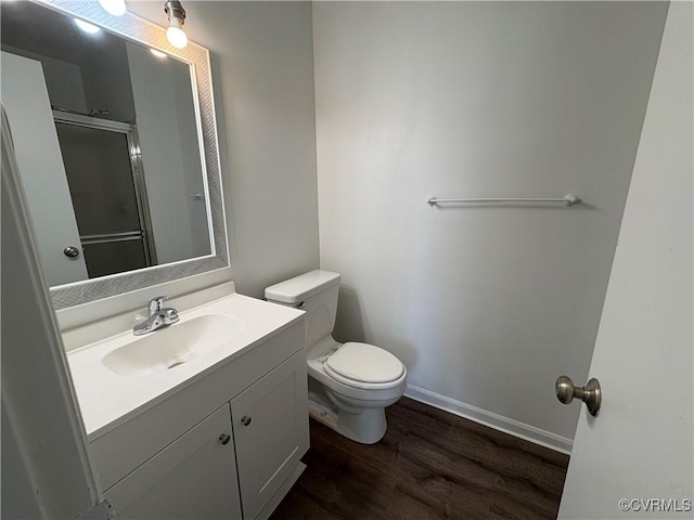 9394 Wind Haven Ct Unit 309, Henrico, VA 23060 - full bathroom featuring toilet, vanity, wood finished floors, an enclosed shower, and baseboards