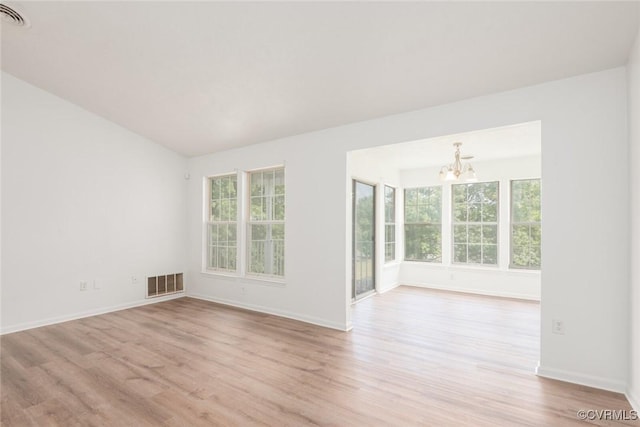 9394 Wind Haven Ct Unit 309, Henrico, VA 23060 - spare room with a chandelier, light wood-type flooring, and baseboards