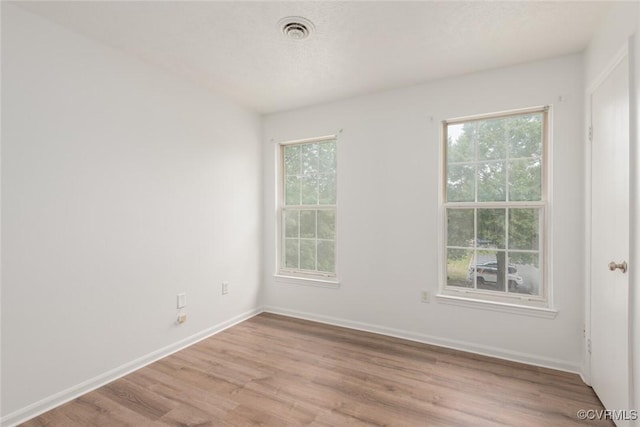 9394 Wind Haven Ct Unit 309, Henrico, VA 23060 - unfurnished room featuring healthy amount of natural light, light wood-style floors, and baseboards
