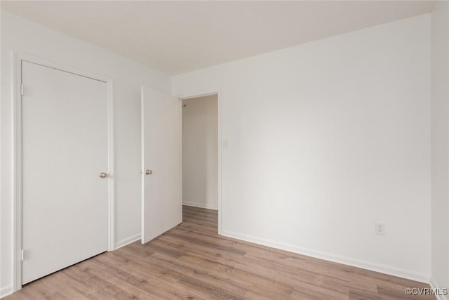 9394 Wind Haven Ct Unit 309, Henrico, VA 23060 - unfurnished bedroom featuring wood finished floors and baseboards