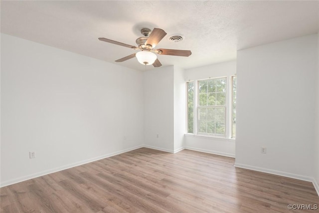 9394 Wind Haven Ct Unit 309, Henrico, VA 23060 - spare room featuring wood finished floors, a ceiling fan, and baseboards