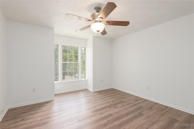 9394 Wind Haven Ct Unit 309, Henrico, VA 23060 - spare room with wood finished floors, ceiling fan, and baseboards
