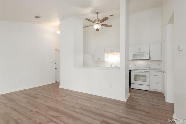 9394 Wind Haven Ct Unit 309, Henrico, VA 23060 - unfurnished living room with high vaulted ceiling, a ceiling fan, wood finished floors, and baseboards