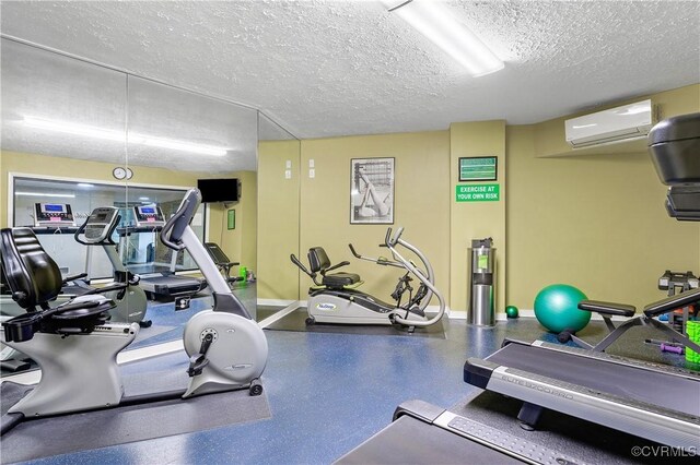 2956 Hathaway Rd Unit 803, Richmond, VA 23225 - workout area with an AC wall unit, a textured ceiling, and baseboards