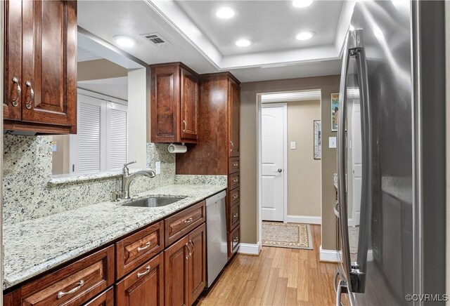 2956 Hathaway Rd Unit 803, Richmond, VA 23225 - kitchen with stainless steel appliances, a sink, light wood-type flooring, tasteful backsplash, and recessed lighting