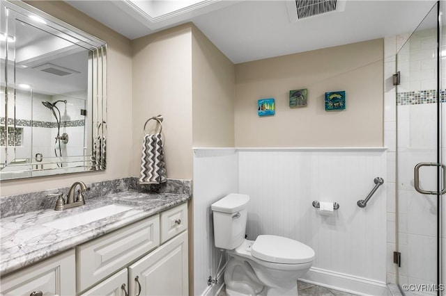2956 Hathaway Rd Unit 803, Richmond, VA 23225 - bathroom featuring vanity, toilet, a stall shower, and a wainscoted wall