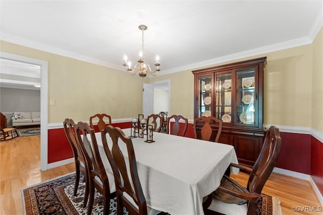 2730 Dalkeith Dr, Henrico, VA 23233 - dining room with a chandelier, crown molding, and light wood finished floors